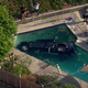 Illustration for article titled Ford Raptor Crashes Into Swimming Pool Despite Childproof Fencingem/em